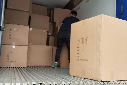 Customer goods being loaded onto the truck